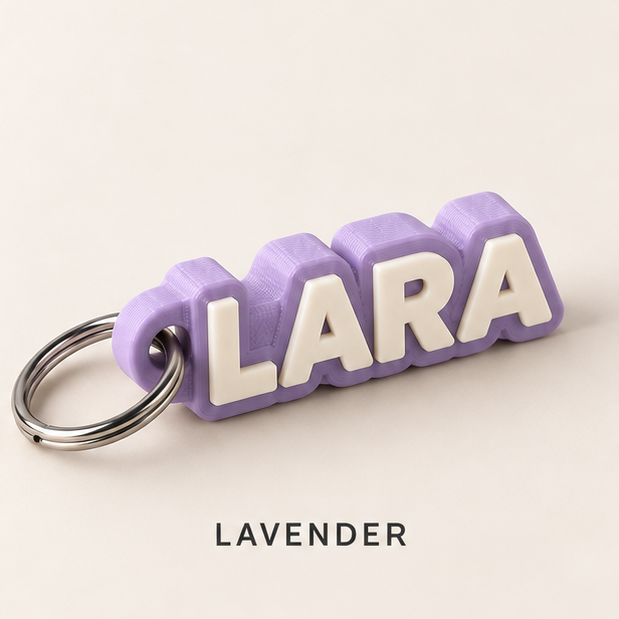 Lavender name keychain with raised white letters spelling LARA on a silver key ring
