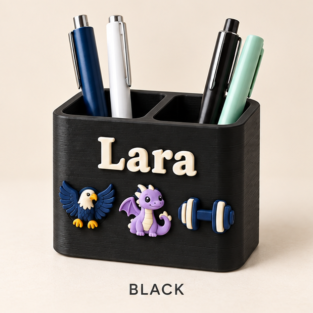 Black two-slot pen holder with the name Lara and eagle, dragon and dumbbell charms on the front