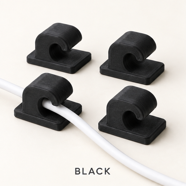 Four black cable clips, two holding a white charging cable
