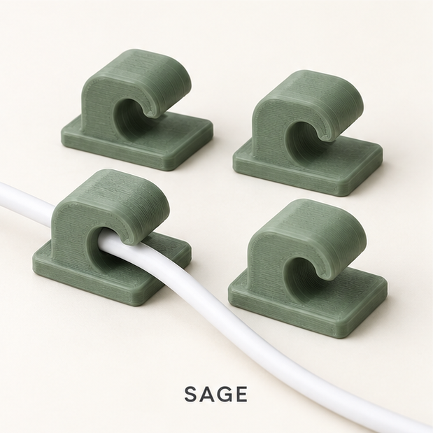Four sage green cable clips, two holding a white charging cable