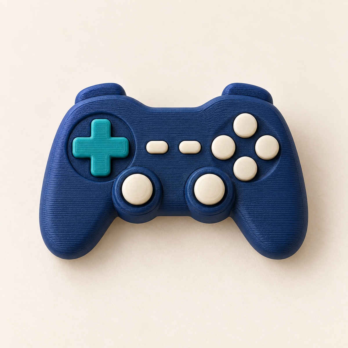 Navy game controller charm with teal and cream buttons