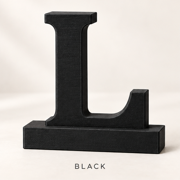 Black letter L monogram stand on a flat base