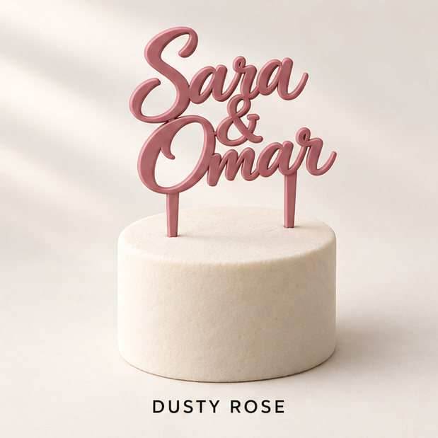 Dusty rose script cake topper reading Sara & Omar on a small white cake