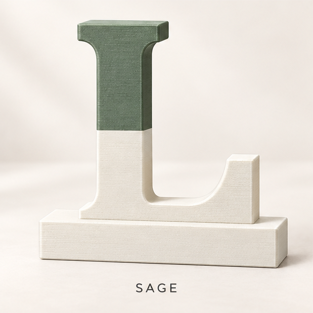 Letter L monogram stand split sage green over cream, on a flat base