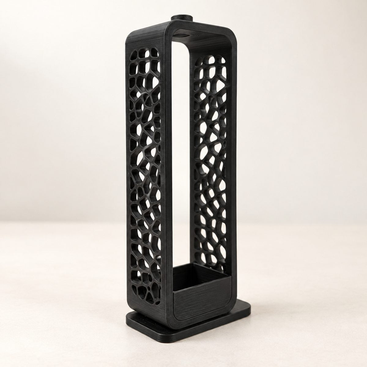 Tall black incense holder with a voronoi lattice pattern and a black ash tray at the base